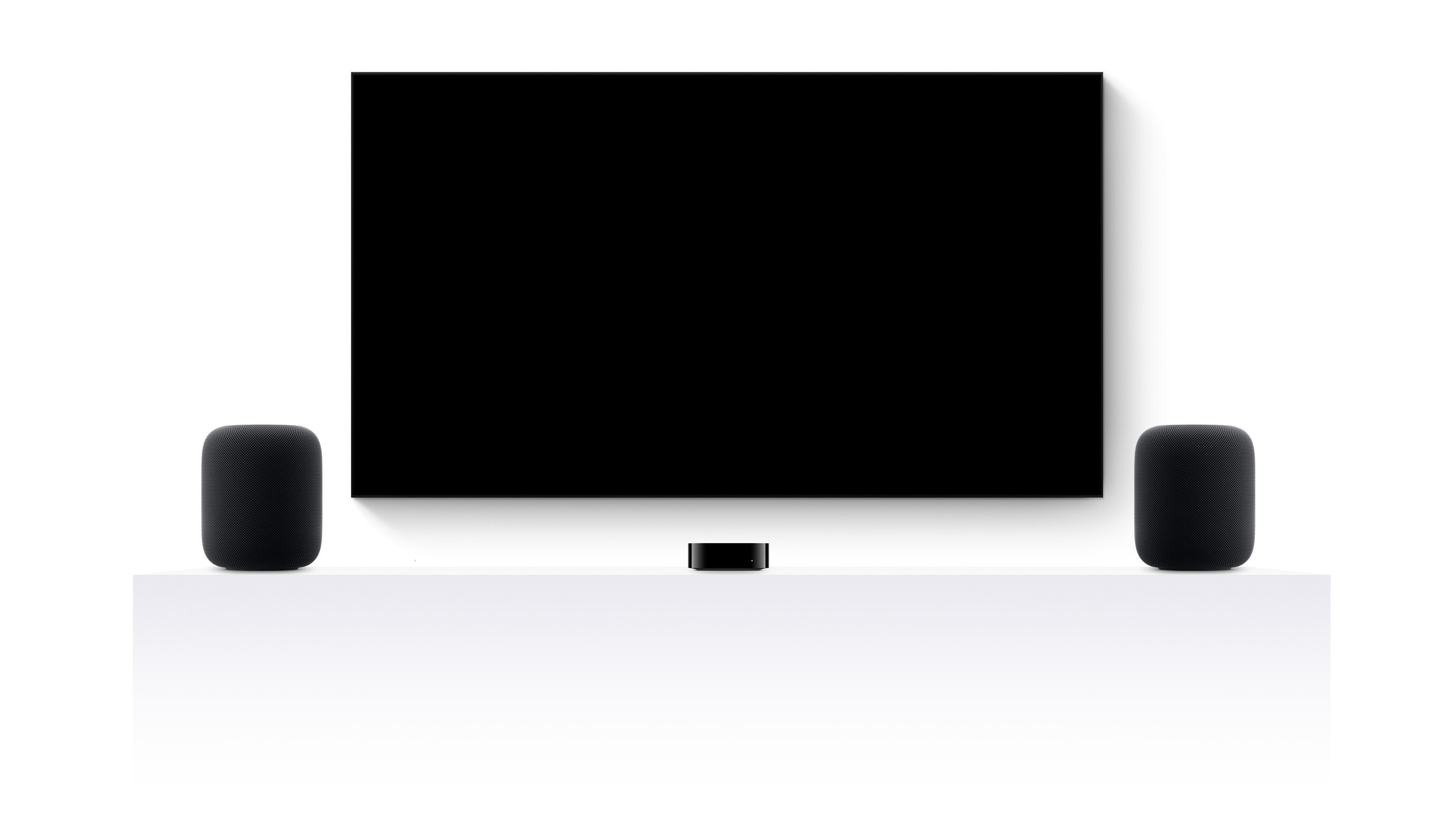 Apple TV 4K, dois HomePods e uma televisão de ecrã plano com o filme Mundo Jurássico: Renascimento