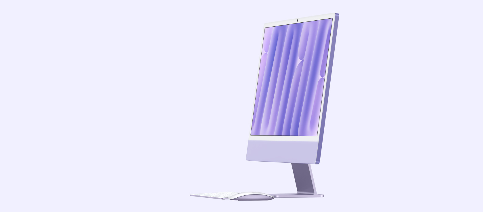 iMac roxo com teclado e mouse