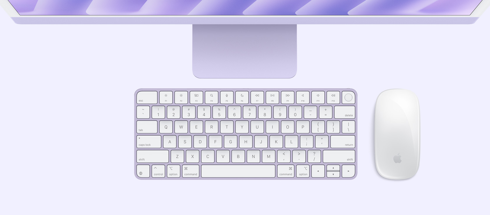 Изглед на виолетов iMac отгоре с мишка и клавиатура в съответстващ цвят