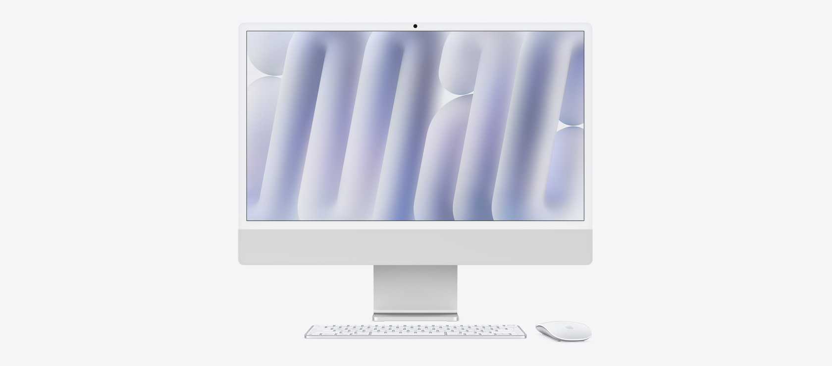 Изглед на сребърен iMac отпред с мишка и клавиатура в съответстващ цвят