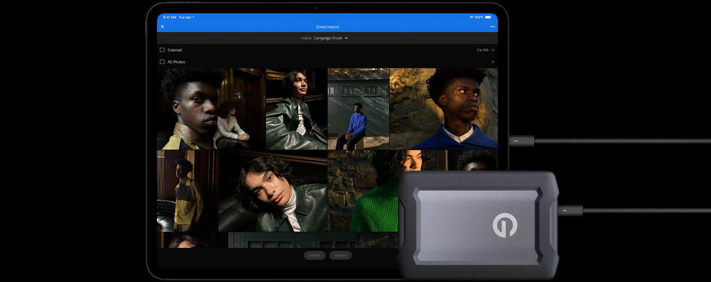 iPad Pro, Vorderansicht, Querformat, Farbe Space Schwarz, über ein Kabel mit einer externen USB‑C Festplatte verbunden, das Display zeigt Fotos von Modellen, die in einen Ordner mit dem Namen «Kampagnen Shooting» importiert werden