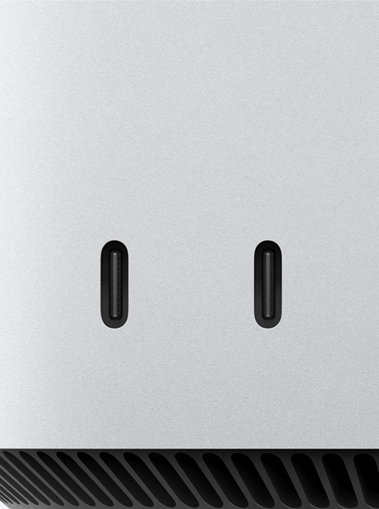 Два порти USB-C на передній панелі Mac mini показано великим планом.