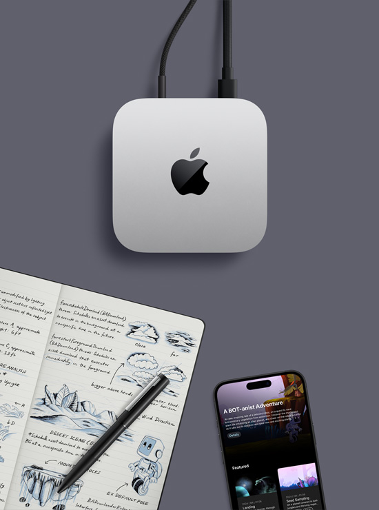 Вид зверху на сріблястий Mac mini з логотипом Apple. Поруч із ним на столі лежать iPhone, ручка та відкритий записник із рукописними нотатками